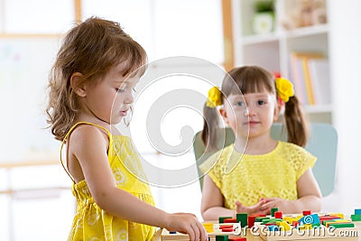 Children learning to sort shapes in kindergarten or daycare center Stock Photo