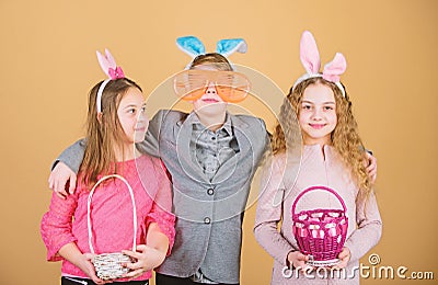 Children with little basket ready hunting for Easter eggs. Easter activity and fun. Friends having fun together on Stock Photo