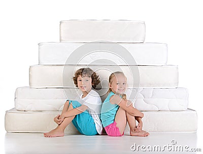 Children and many mattresses Stock Photo