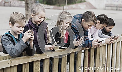 Children with mobile devices Stock Photo