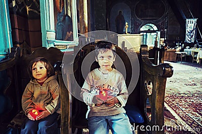 Children in an orthodox church Stock Photo