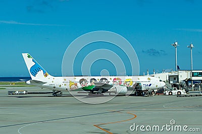 Children painted on airplane at Naha airport Editorial Stock Photo