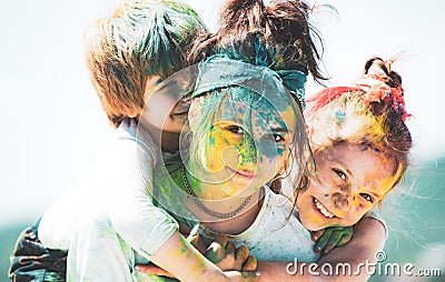 Children with paintings face. Happy children embracing each other and smiling. Stock Photo