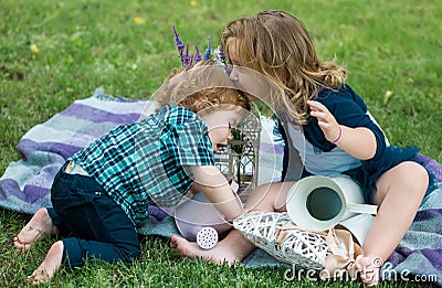 Children on pirnic. Lifestyle portrait baby child in happines at the outside in the meadow. Stock Photo