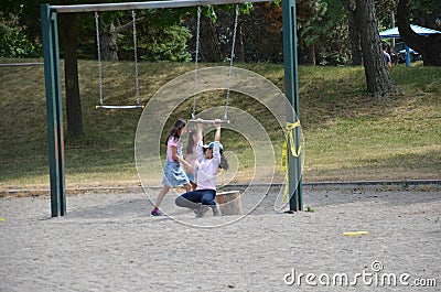 Children play on a closed Toronto public playground during the Covid-19 Pandemic. Editorial Stock Photo