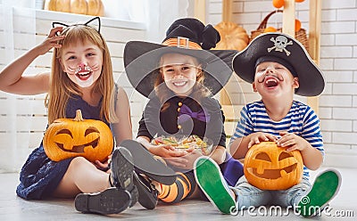 Children play with pumpkins Stock Photo