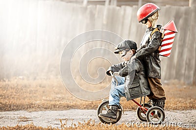Children play in the rider and the rocketman Stock Photo