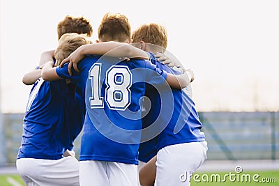 Children Play Sports in a Team. Boys Huddling Before the Game Stock Photo