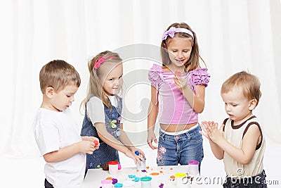 children play with toys against white background Stock Photo