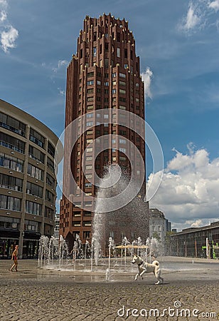 Children play in the water flows from the fountain in front of the Main Plaza Tower, Frankfurt, Germany Editorial Stock Photo