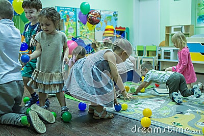 Children playing active games in the kindergarten. Editorial Stock Photo