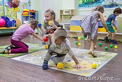 Children playing active games in the kindergarten. Editorial Stock Photo