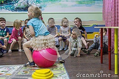 Children playing active games in the kindergarten. Editorial Stock Photo