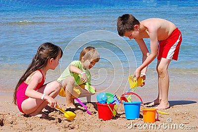 Children playing at the beach Stock Photo