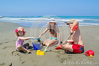 Children playing on the beach Stock Photo