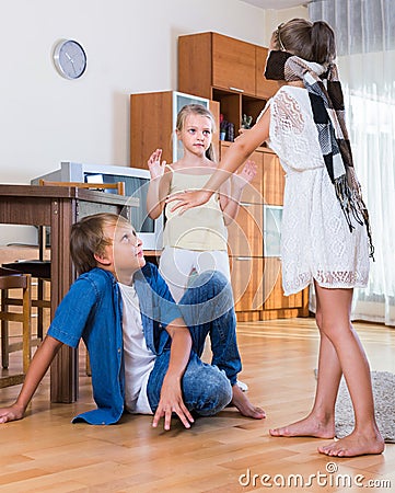 Children playing at Blind man bluff indoors Stock Photo