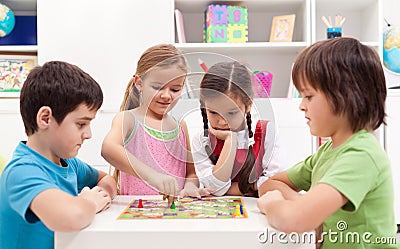 Children playing board game Stock Photo