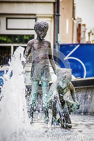 Children playing in fountains statues in Charlotte North Carolina Wells Fargo Plaza Editorial Stock Photo