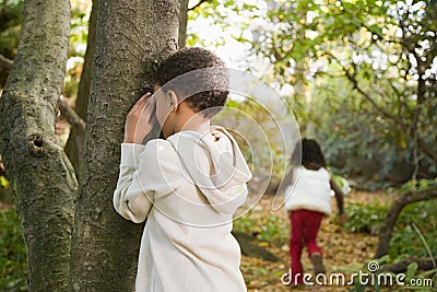 Children playing hide and seek Stock Photo