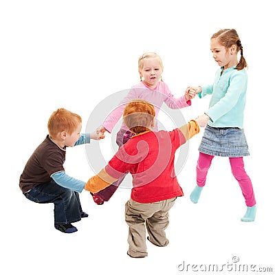 Children playing kids game holding hands in circle Stock Photo