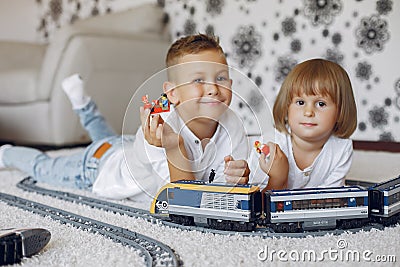 Children playing with lego and toy train in a playing room Editorial Stock Photo