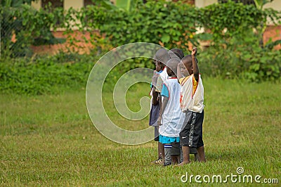 Children playing on a meadow on a cloudy day in May Editorial Stock Photo