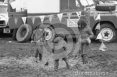 Children playing in mud Editorial Stock Photo