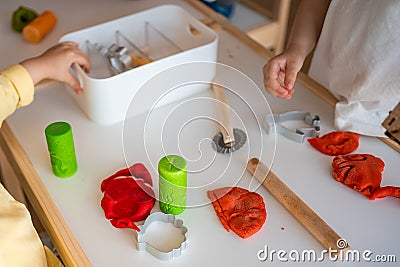 Children playing with plasticine. Sensory development and experiences, themed activities with children, fine motor Stock Photo