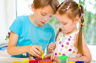 Children Playing with Play Dough Stock Photo