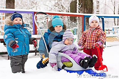 Children playing in snow outdoor Stock Photo