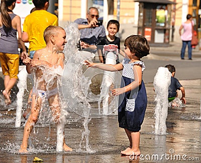 Children playing in water pool Editorial Stock Photo