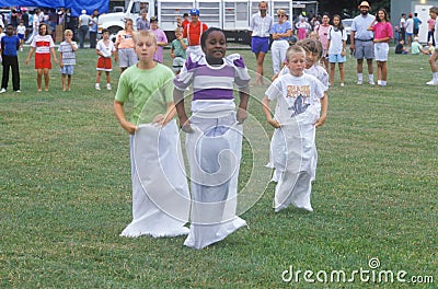 Children in potatoe sack race Editorial Stock Photo