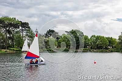 Children practicing sailing on a Spring day in South Norwood lake Editorial Stock Photo