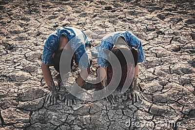 Children praying for the rain on lake Stock Photo