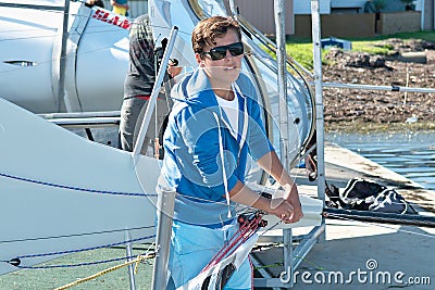 Children preparing racing dinghies at championships. April 18, 2013: Editorial Editorial Stock Photo