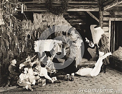 Children receiving Christmas presents from Santa Claus Editorial Stock Photo