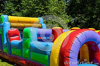 Children ride on an inflatable, children attraction fragment Stock Photo