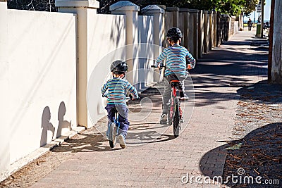 Children riding bicycles in Glenelg Stock Photo