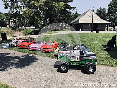 Children's battery operated cars of all sizes.. trucks, corvettes, motorcycle (4 wheel) Editorial Stock Photo