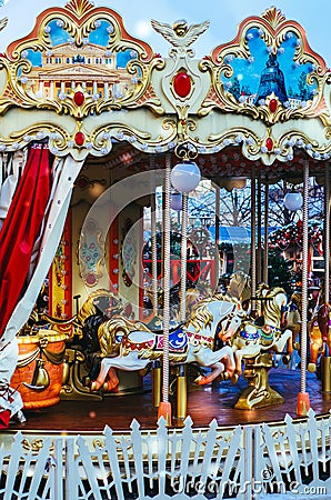 Children`s carousel in Moscow. Two-storey carousel with horses. Merry go round horses Stock Photo