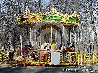 Children`s carousel yellowish green with small animals Stock Photo