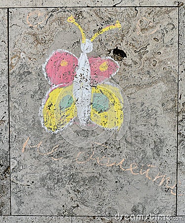 Children`s chalk drawing on a textured wall Stock Photo