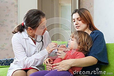 Children's doctor examining 2 years child Stock Photo