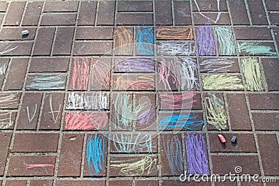 Children`s drawing with colored chalks on paving tiles Stock Photo