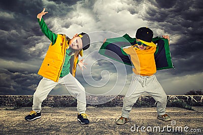 Two brothers dancing break dance.Hip-hop style.The cool kids.Children`s fashion. Stock Photo