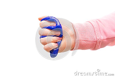 Children`s hand squeezes blue slime. Girl holding mucus in his fist Stock Photo