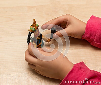 Children`s hands play with plasticine Stock Photo