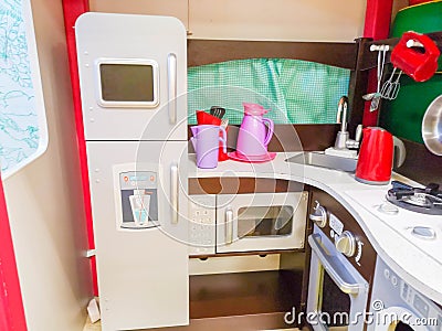 Children`s kitchen, kindergarten and toys for children. Small kitchen. Miniature cooking area Stock Photo