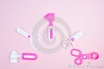 The concept of a pediatrician. Pediatrics. Toy medical devices on a pink background. Children play professional doctor. Choice of Stock Photo