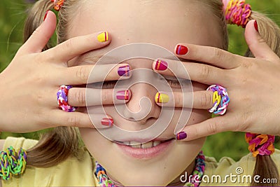 Children`s multicolored manicure. Stock Photo